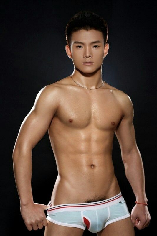 Asian guy posing in playgirl