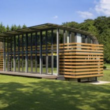 Metal Roof Houses - curved steel roof home by Dutch architects