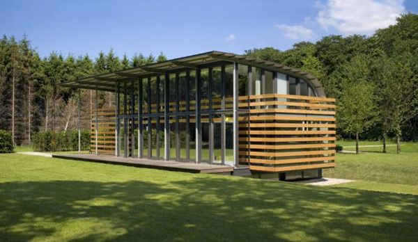 Metal Roof Houses - curved steel roof home by Dutch architects