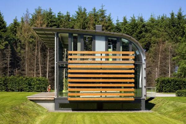Metal Roof Houses - curved steel roof home by Dutch architects