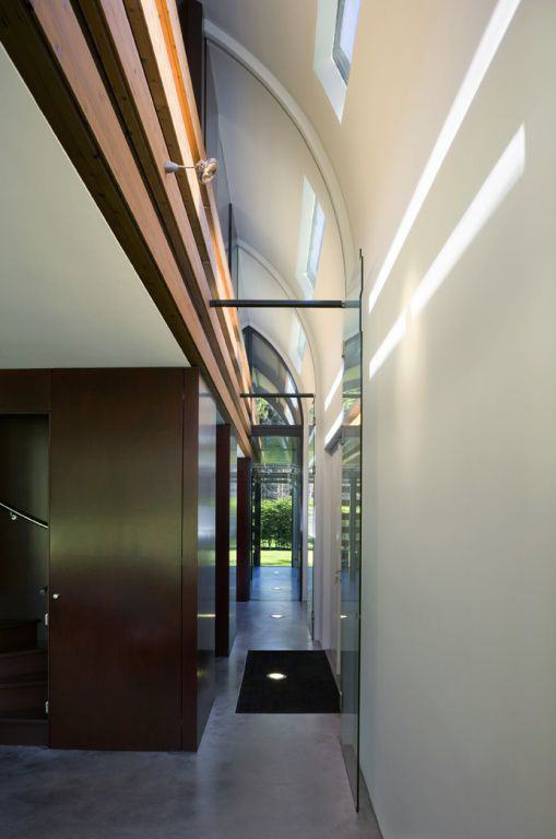 Metal Roof Houses - curved steel roof home by Dutch architects