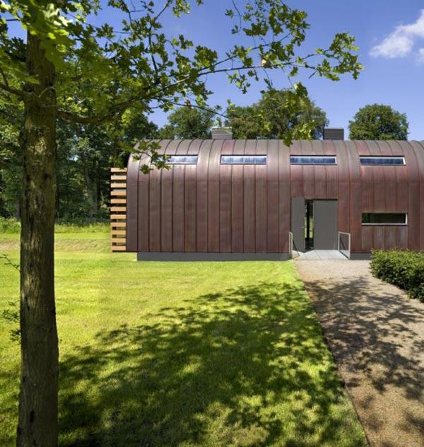 Metal Roof Houses - curved steel roof home by Dutch architects