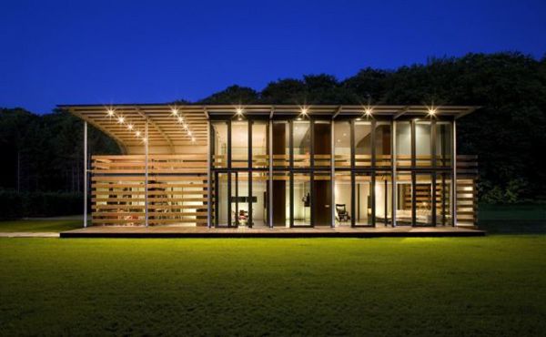 Metal Roof Houses - curved steel roof home by Dutch architects