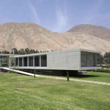 Concrete and Glass Home blends with the Andes