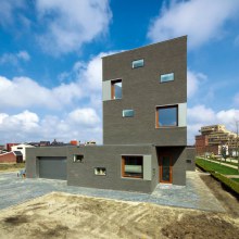 Brick House Design in Netherlands - asymmetrical, with two faces