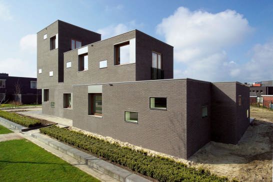 Brick House Design in Netherlands - asymmetrical, with two faces