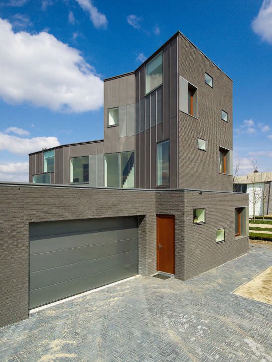 Brick House Design in Netherlands - asymmetrical, with two faces