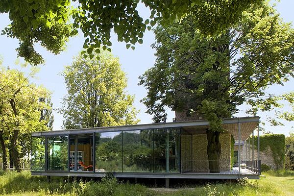 Modern Glass Home in Krakow, Poland comes with a tree and a tower!