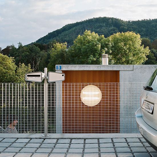 Concrete Prefab House - contemporary design in Switzerland, filled with popular modern furniture