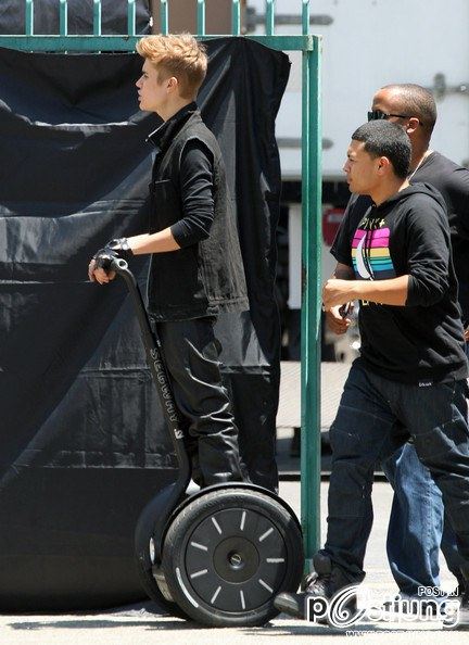 Justin Bieber Keeps His Gold Sneakers Clean Driving a Segway