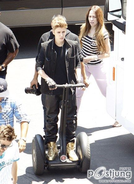Justin Bieber Keeps His Gold Sneakers Clean Driving a Segway