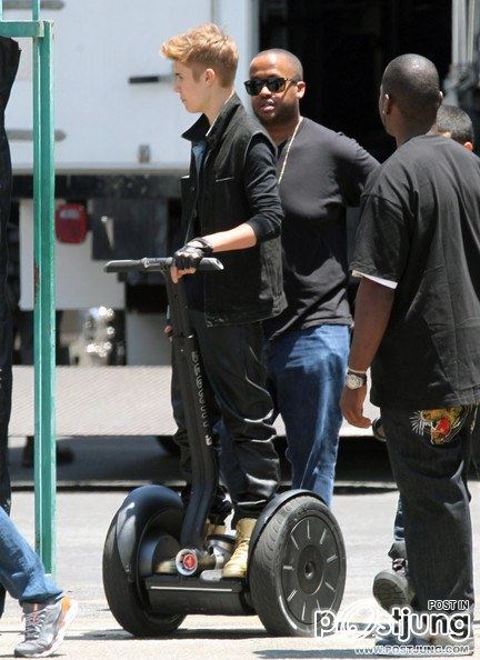 Justin Bieber Keeps His Gold Sneakers Clean Driving a Segway