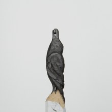 A Raven and Elephant Carved from Graphite Pencil Tips by Diem Chau