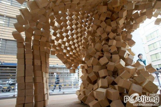 7000 wooden cubes linked together in an inverted question-cube