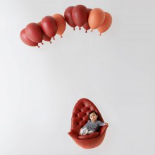 Chair that Looks Like It’s Being Lifted by Balloons