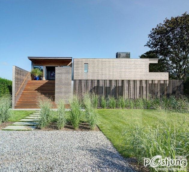 Earthy Timber Clad Interiors vs. Urban Glass Exteriors: Cottage Design by Bates Masi Architects