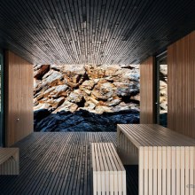 Timber Cabin Built into Cliff Side Site