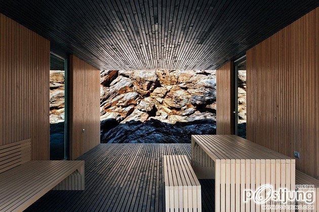 Timber Cabin Built into Cliff Side Site