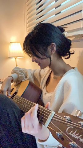 Playing guitar