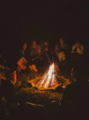 Chitchat and telling ghost stories with other campers