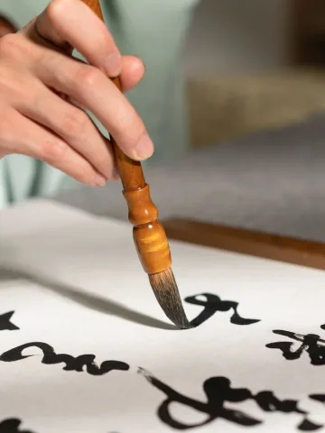 พู่กันกับสมุด