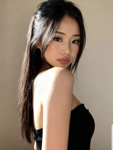 Asian looks, black long hair with dark brown eyes