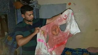 เสื้อผ้าเปื้อนเลือดของอาสาสมัครพยาบาลหญิงปาเลสไตน์