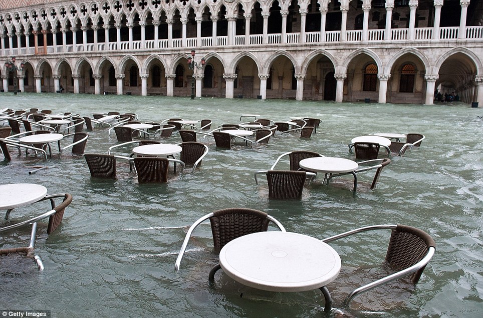 Water, water everywhere: The usually crowded Saint Mark′s Square was deserted as flood 
waters rose making it impossible to visit