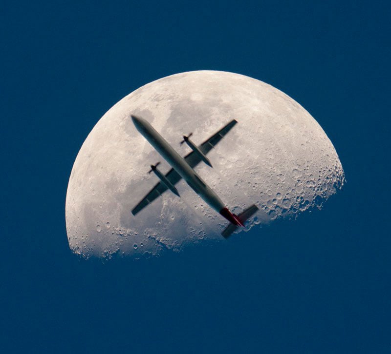 airplane-passing-the-mooon-perfect-timing