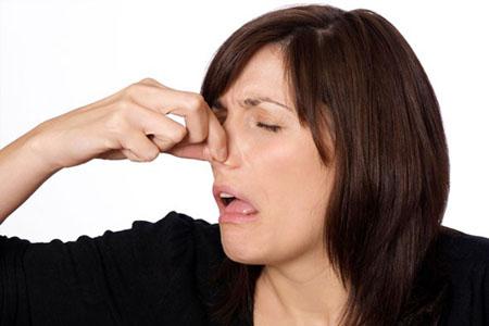 woman-holding-nose-smell-590kb080910