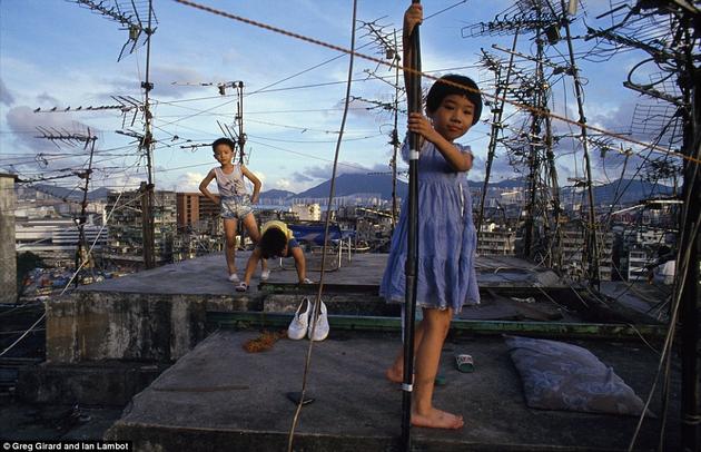 Kids playing on the roof tops of Kowloon.