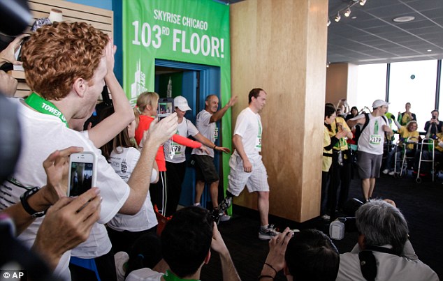 Here he is! With a roar of applause and every camera snapping Zac Vawter stepped up to the 103rd floor