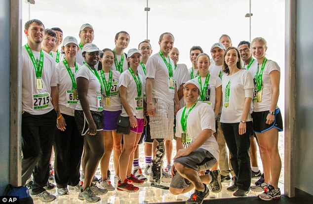 Pack: Posing with a group of researchers from the Rehabilitation Institute of Chicago, Mr Vawter is seen centre after they completed their trek