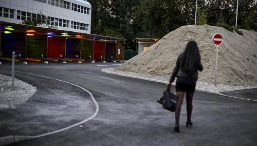 A prostitute walks past so-called 