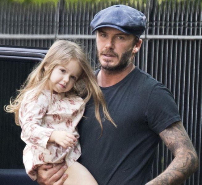 119404, EXCLUSIVE: David Beckham wheels a bag with daughter Harper perched on top before heading to their car in London. London, United Kingdom - Friday May 16, 2014. UK, AUSTRALIA & NEW ZEALAND & GERMANY OUT - NO WEB USE. Photograph: © PacificCoastNews. Los Angeles Office: +1 310.822.0419 London Office: +44 208.090.4079 sales@pacificcoastnews.com FEE MUST BE AGREED PRIOR TO USAGE