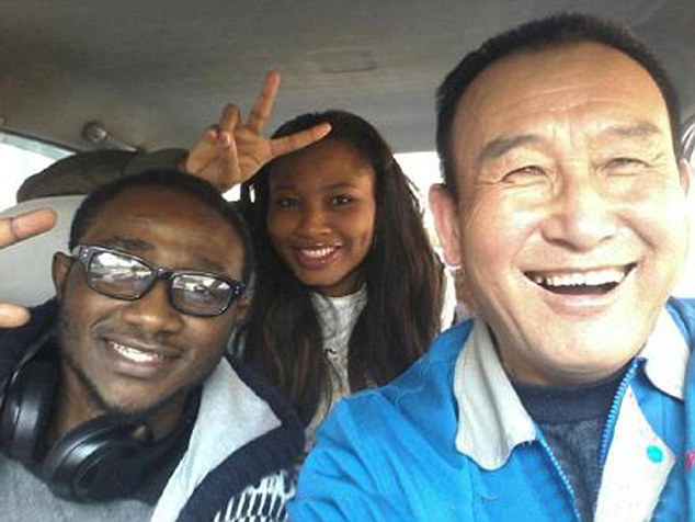 Infectious smile: Uncle Teng asks passengers for a picture in lieu of a tip in Shenyang, China