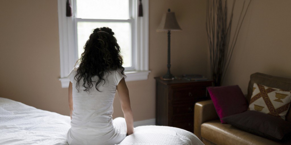 o-woman-looking-out-window-facebook-1024x512