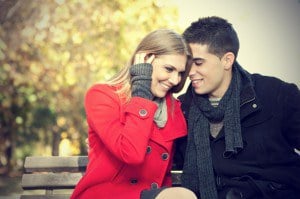 romantic-couple-sitting-in-a-park