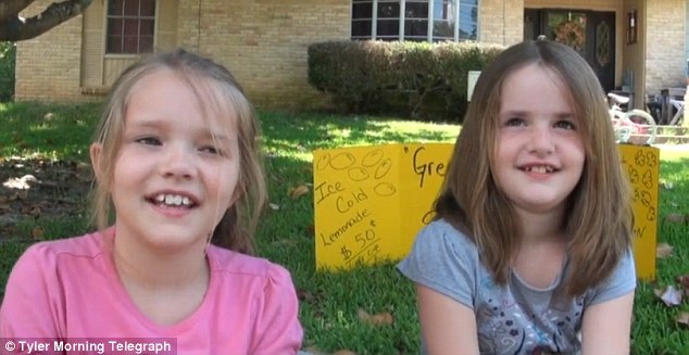 Shut down: Zoey and Andria Green, pictured, were selling lemonade for 50 cents a cup - but police told them to stop