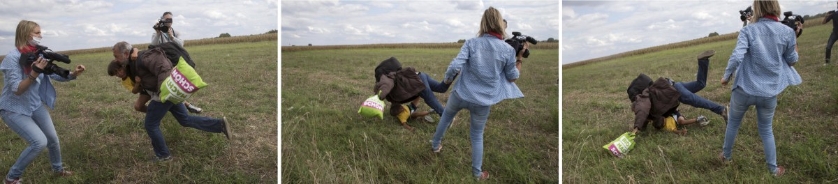 A Hungarian TV camerawoman trips a migrant carrying a child while trying to escape from a collection point in Roszke village, Hungary.