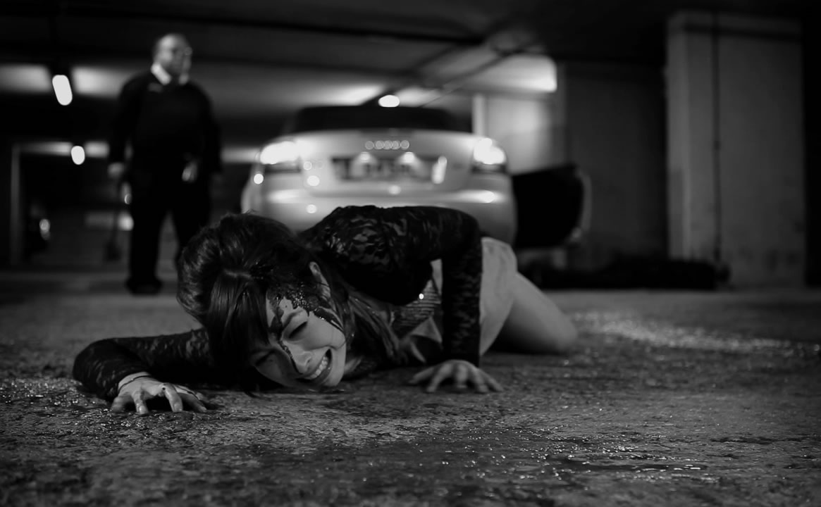 woman bleeding on the ground, killer coming behind her, The Human Centipede II: (Full Sequence)