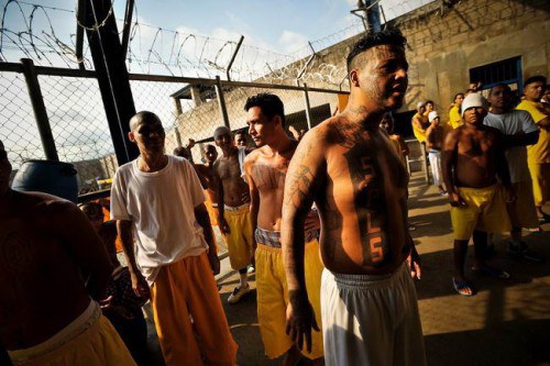 Members of the MS-18 gang incarcerated in Izalco mens' prison in El Salvador inside pass the afternoon in the prison yard.