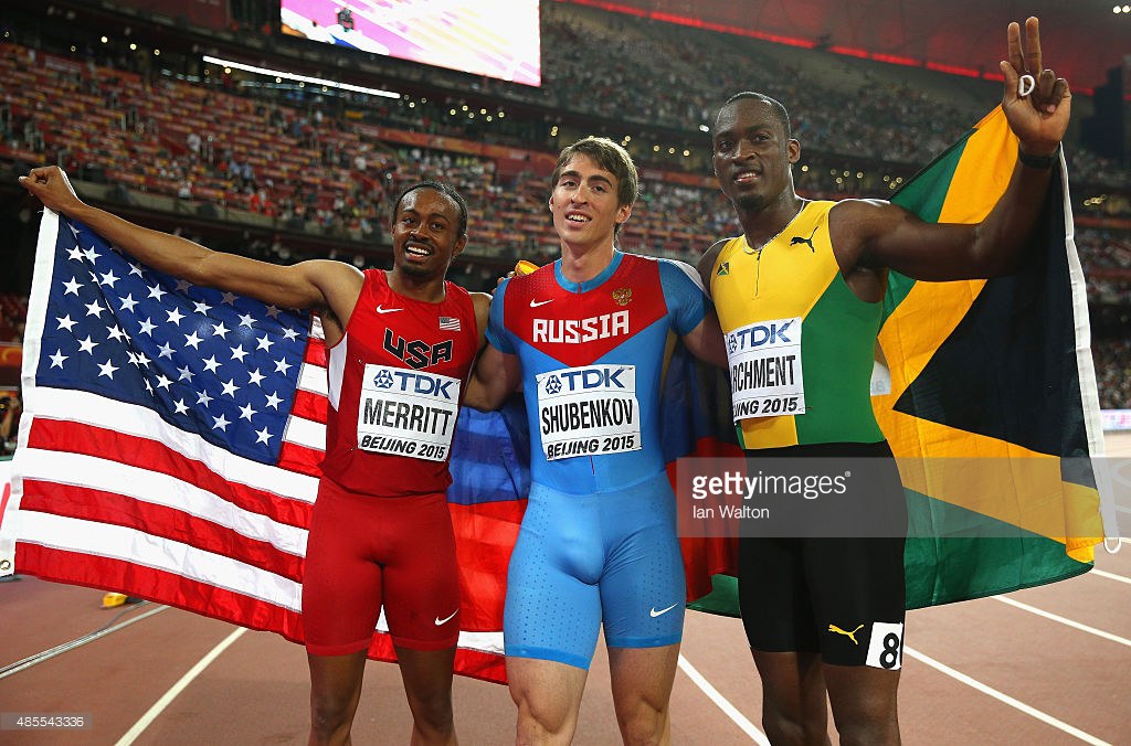 Gold medalist Sergey Shubenkov of Russia (C) celebrates with bronze medalist Aries Merritt of the United States (L) and silver medalist Hansle Parchment of Jamaica after the Men's 110 metres hurdles final during day seven of the 15th IAAF World Athletics Championships Beijing 2015 at Beijing National Stadium on August 28, 2015 in Beijing, China.