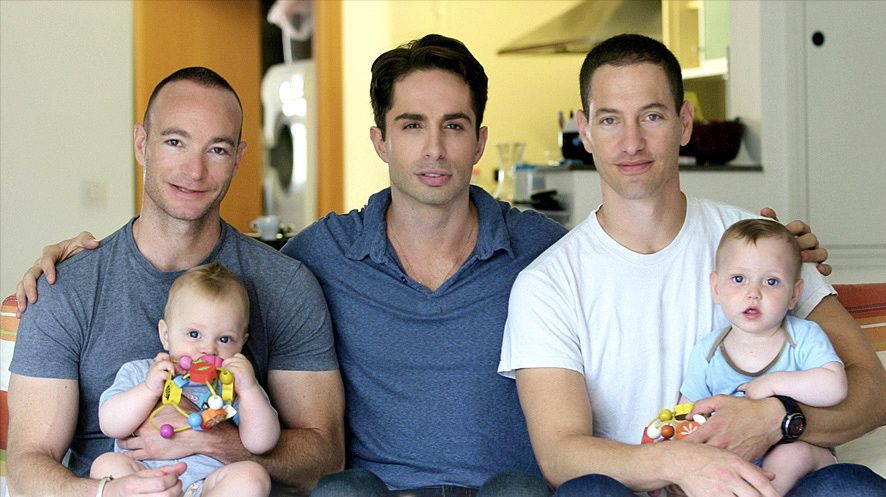 Michael Lucas, center, with a pair of gay fathers featured in his documentary.